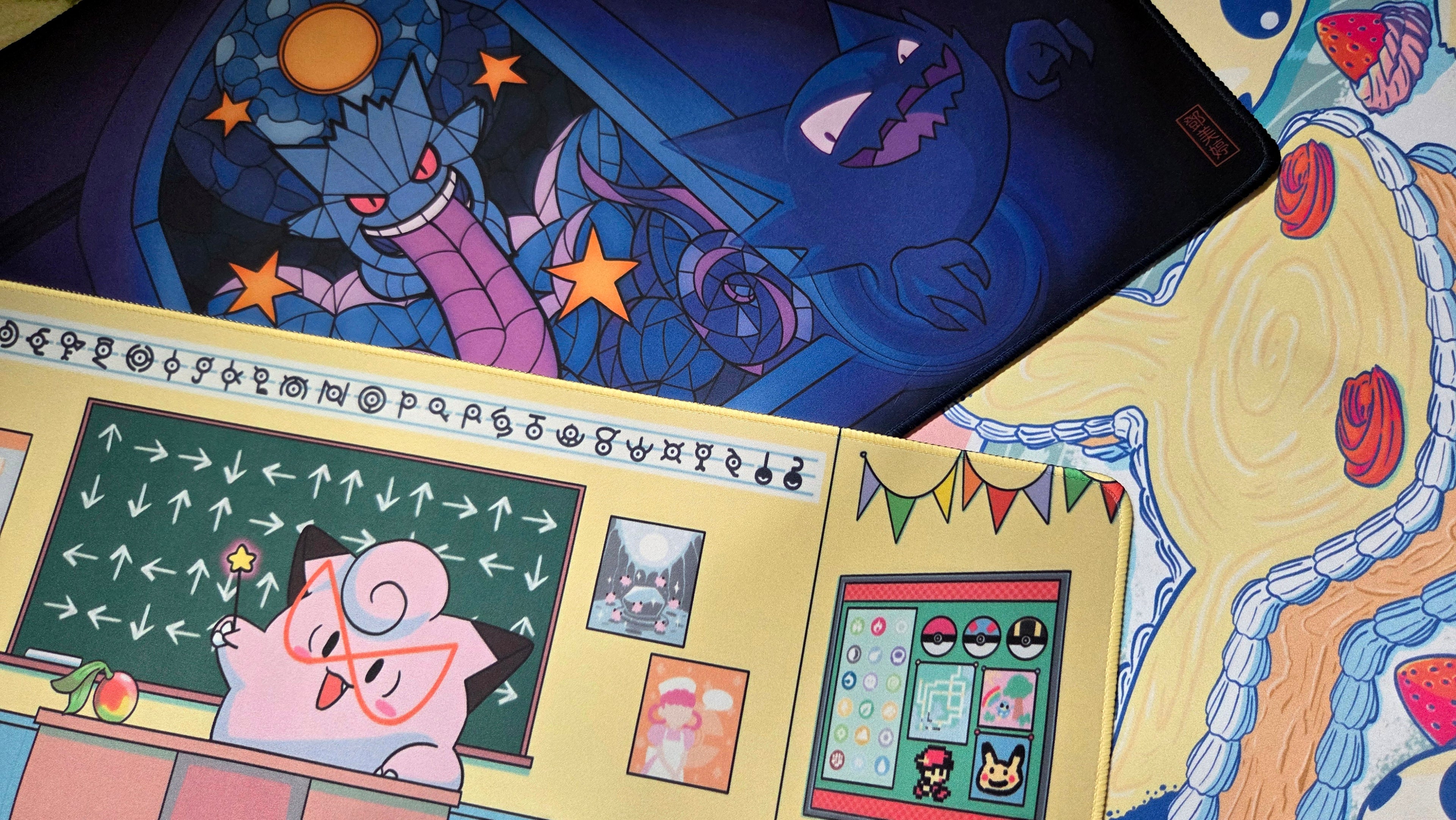 A photo of three playmats overlapping each other.